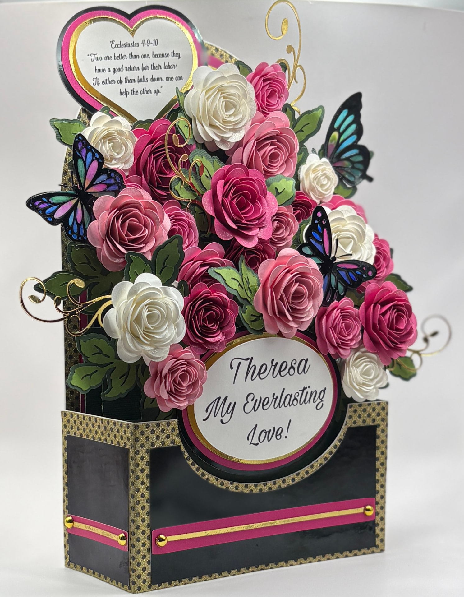 Heirloom keepsake: a black and gold box with deep magenta, blush and ivory roses, iridescent butterflies, a scripture heart and a 'Theresa, My Everlasting Love' oval plaque