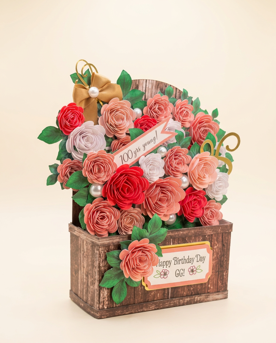 Angled view of the birthday crate keepsake showing the depth of the hand-rolled paper roses and gold bow
