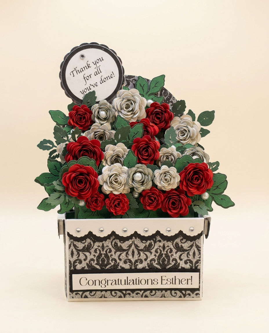Black, silver damask and ivory keepsake filled with red and pearl paper roses with a personalized 'Congratulations Esther!' plaque